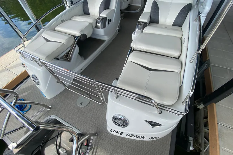 Slide: The Image of 2018 Manitou 25 X-Plode SRW SHP boat interior with white seating, docked at Lake Ozark, MO. - 14