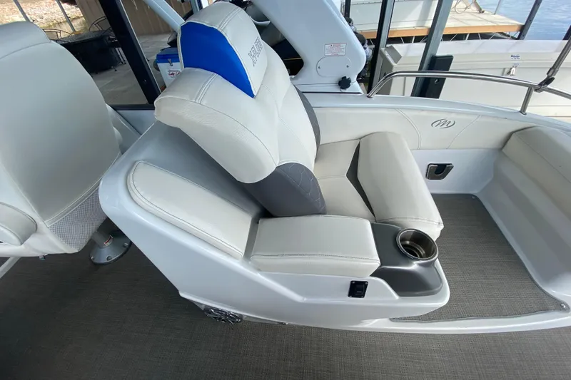 Slide: The Image of Luxurious seating on 2018 Manitou 25 X-Plode SRW SHP boat with cup holder. - 18