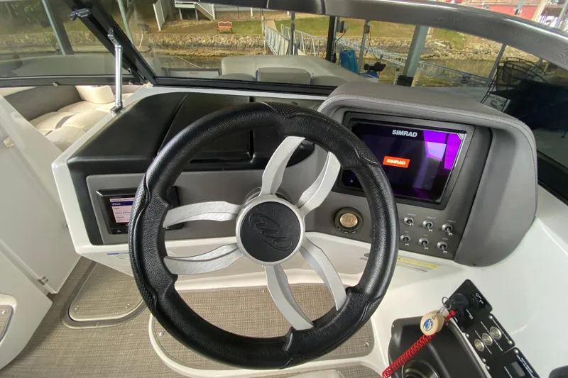 Slide: The Image of 2018 Manitou 25 X-Plode SRW SHP dashboard with steering wheel and Simrad display. - 23