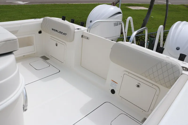 Slide: The Image of 2026 World Cat 295 CC boat interior with Yamaha engines, featuring spacious seating and storage. - 15