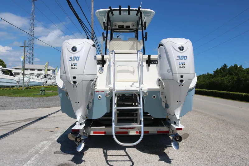 Slide: The Image of 2026 World Cat 295 CC boat with dual Yamaha 300 V6 engines, rear view. - 4