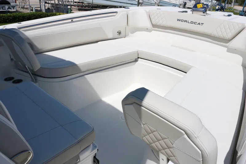 Slide: The Image of 2026 World Cat 295 CC boat interior with white cushioned seating and sleek design. - 6