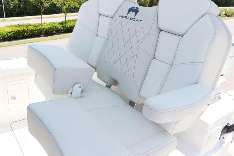 Slide: The Image of Luxurious seating on 2026 World Cat 295 CC boat, featuring white upholstery and armrests. - 9