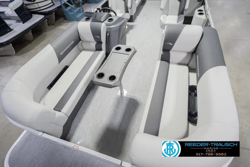 Slide: The Image of 2026 Bennington 22 SSR pontoon boat interior with gray seating and cup holders. - 12
