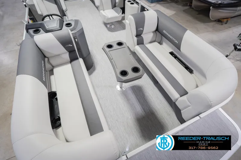 Slide: The Image of 2026 Bennington 22 SSR pontoon boat interior with gray seating and cup holders. - 13