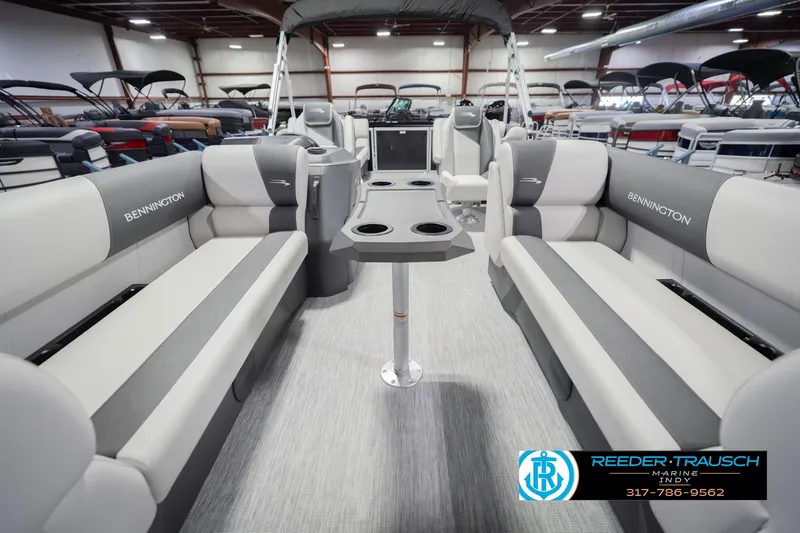 Slide: The Image of 2026 Bennington 22 SSR pontoon boat interior with gray seating and cup holders. - 16