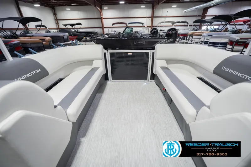 Slide: The Image of 2026 Bennington 22 SSR pontoon boat interior with spacious seating in a showroom. - 18