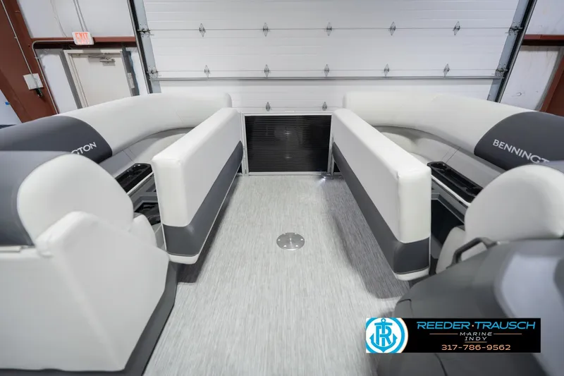 Slide: The Image of 2026 Bennington 22 SSR boat interior with white seating and modern design. - 23