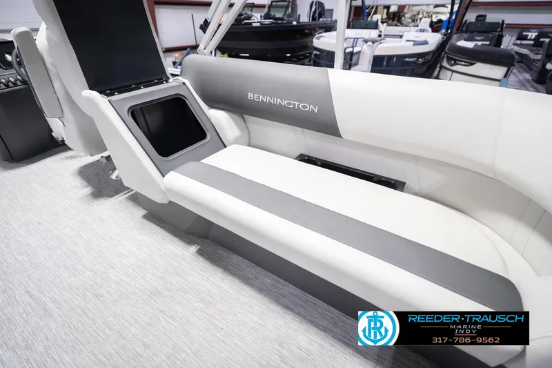 Slide: The Image of 2026 Bennington 22 SSR boat interior with sleek seating and storage compartment. - 29