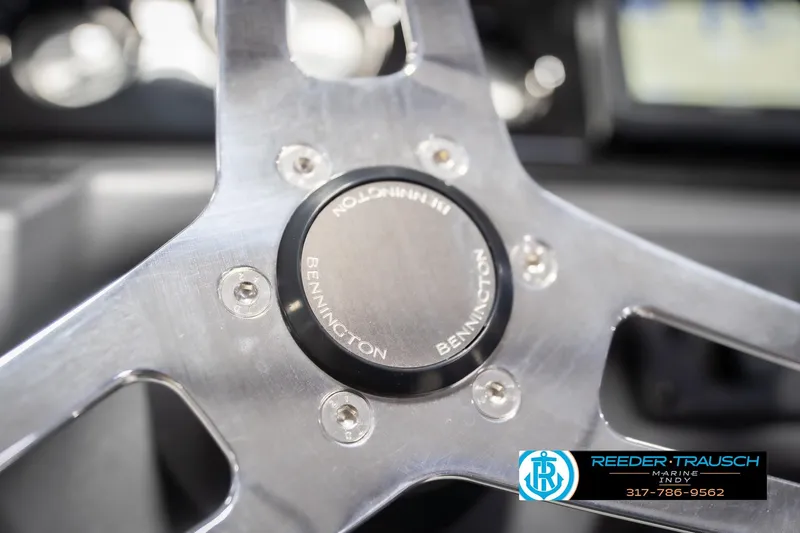 Slide: The Image of Steering wheel of 2026 Bennington 22 SSR boat, featuring sleek metallic design. - 33