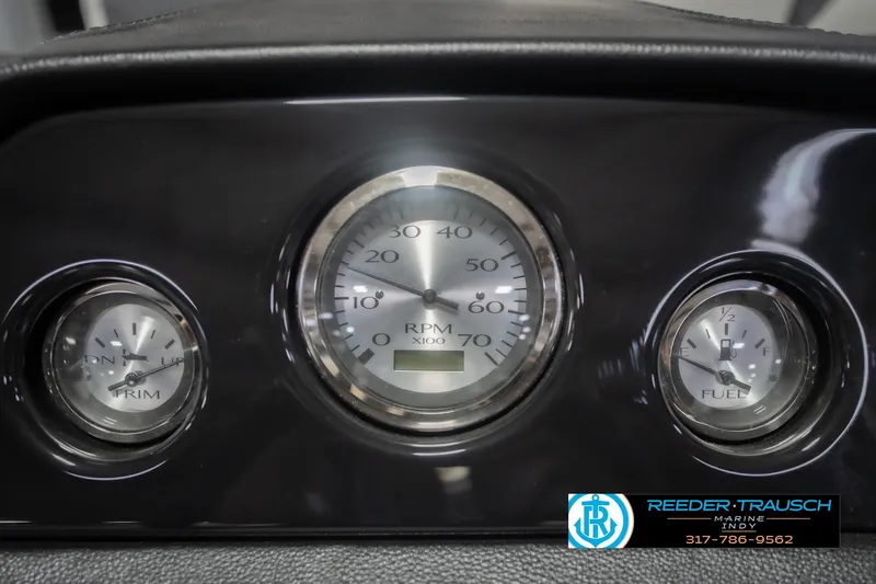 Slide: The Image of Dashboard gauges of a 2026 Bennington 22 SSR boat, showing RPM, trim, and fuel levels. - 36