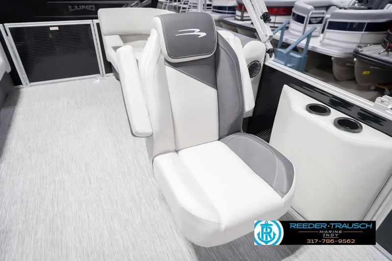 Slide: The Image of 2026 Bennington 22 SSR boat seat with gray and white upholstery, cup holders, and logo. - 43