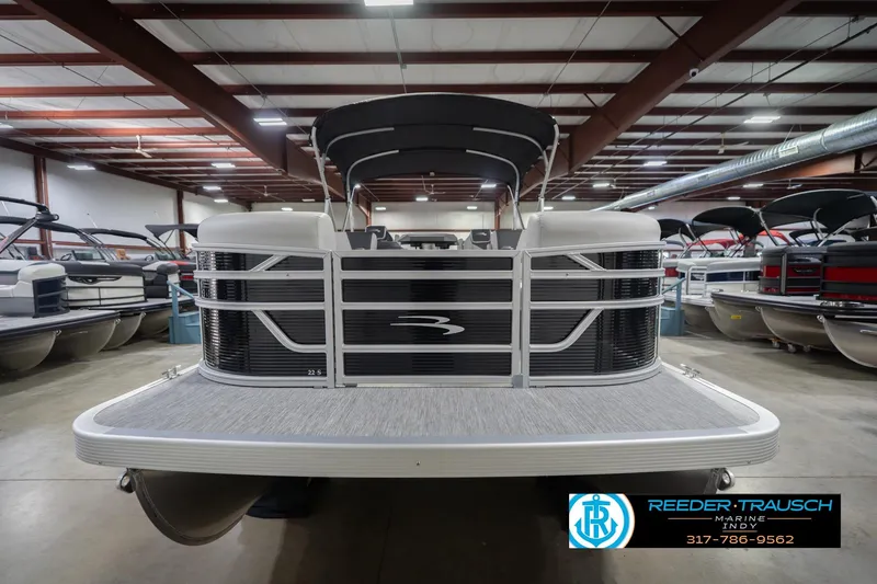 Slide: The Image of 2026 Bennington 22 SSR pontoon boat in showroom, front view. - 5