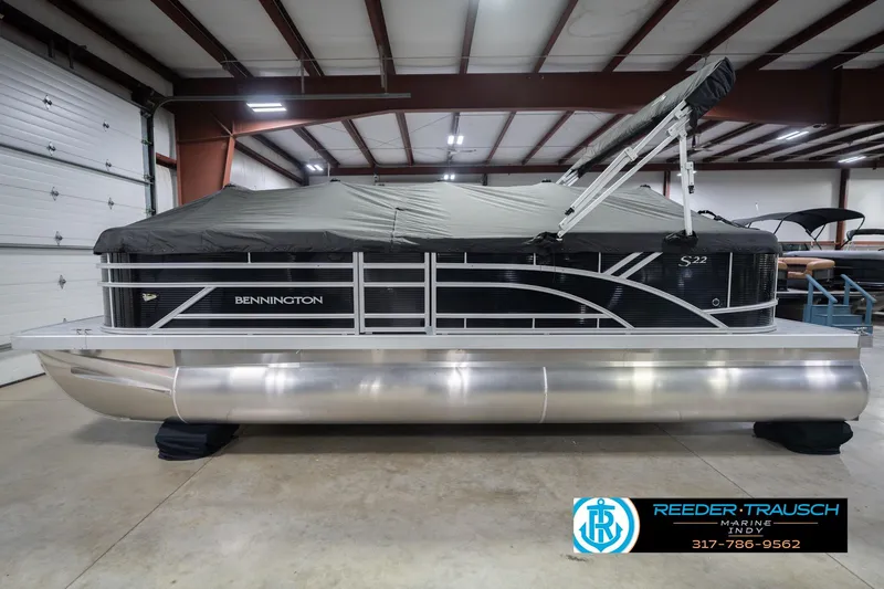 Slide: The Image of 2026 Bennington 22 SSR pontoon boat in a showroom with protective cover. - 52
