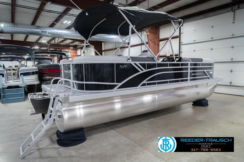 Slide: The Image of 2026 Bennington 22 SSR pontoon boat displayed in indoor showroom. - 8