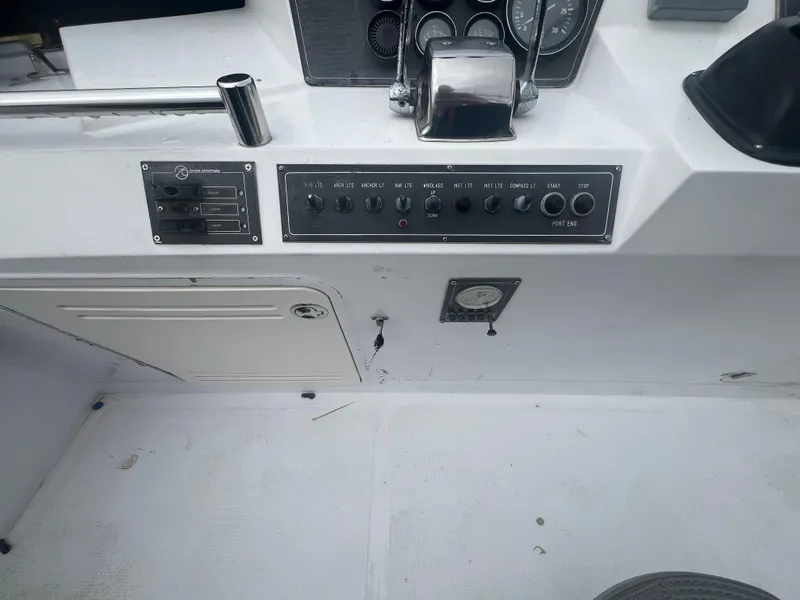 Slide: The Image of Control panel of a 1990 Pace 42 Motor Yacht with switches and gauges. - 11
