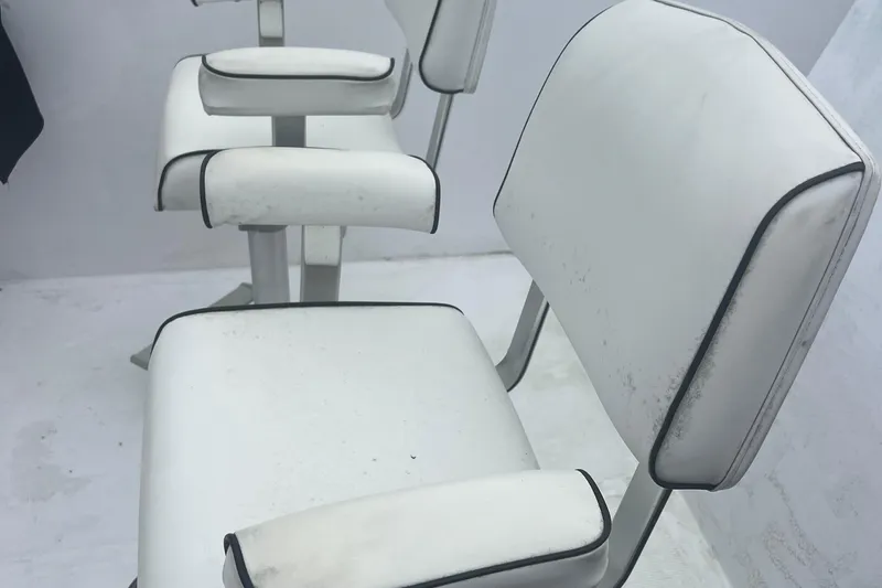 Slide: The Image of White seats on a 1990 Pace 42 Motor Yacht deck. - 13