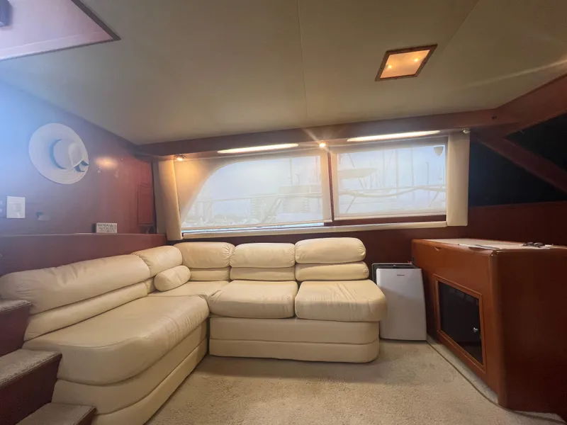 Slide: The Image of Luxurious interior of 1990 Pace 42 Motor Yacht with cream leather seating. - 17