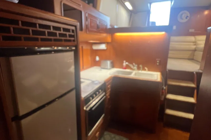 Slide: The Image of Interior of 1990 Pace 42 Motor Yacht with kitchen and stairs. - 19