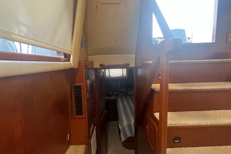 Slide: The Image of Interior of 1990 Pace 42 Motor Yacht with wooden stairs and cozy cabin. - 25
