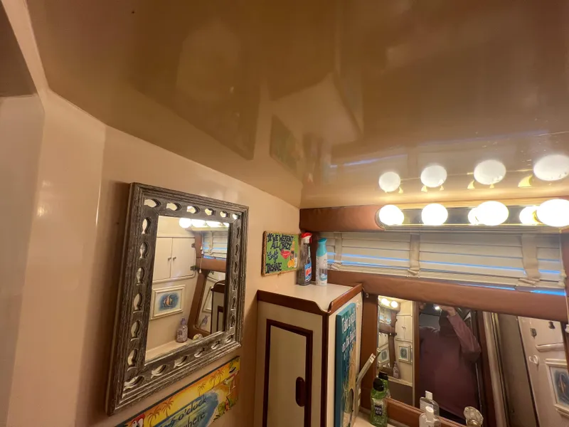 Slide: The Image of Interior of 1990 Pace 42 Motor Yacht bathroom with mirror and vanity lights. - 30