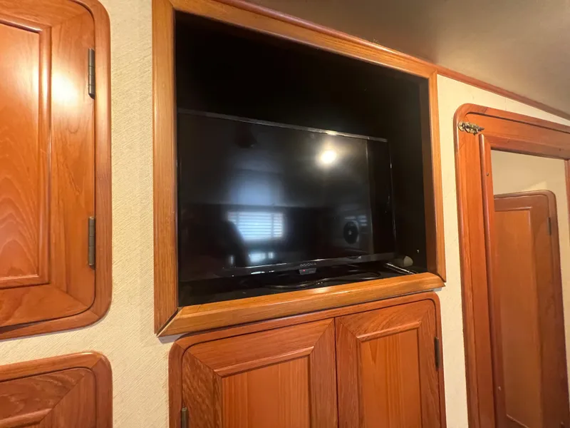 Slide: The Image of Built-in TV in wooden cabinet on 1990 Pace 42 Motor Yacht interior. - 33