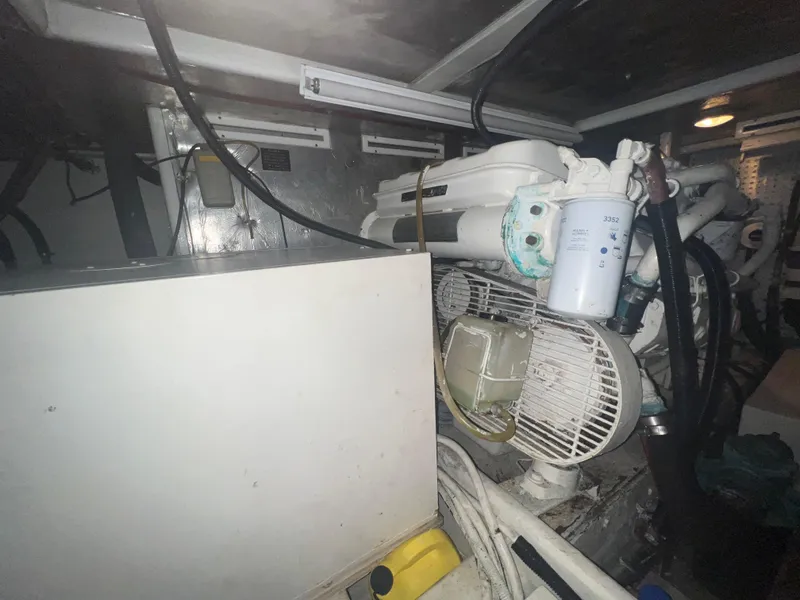 Slide: The Image of Engine room of 1990 Pace 42 Motor Yacht with visible machinery and components. - 48