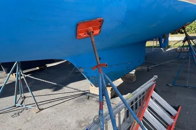 Slide: The Image of Blue Gozzard 37 sailboat hull on stands, 2000 model, in a boatyard. - 10