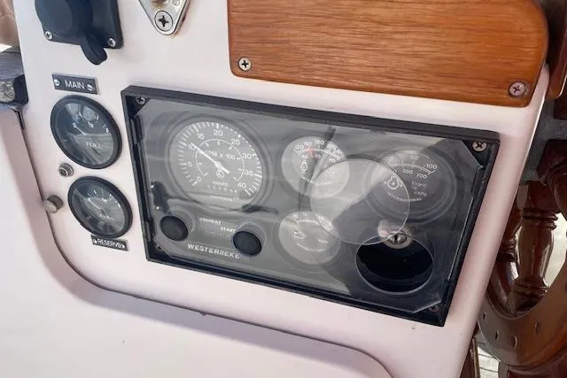 Slide: The Image of Control panel of a 2000 Gozzard 37 sailboat with gauges and switches. - 12