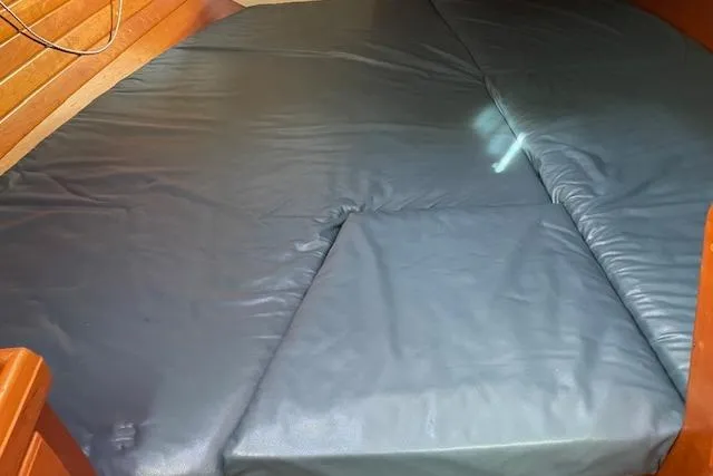 Slide: The Image of Interior cabin of 2000 Gozzard 37 sailboat with cushioned seating. - 32