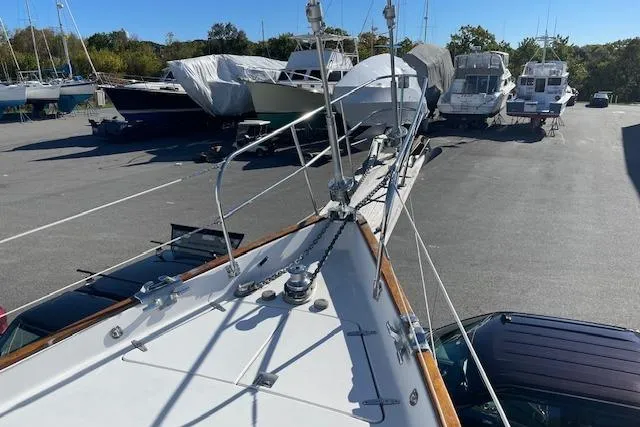 Slide: The Image of Gozzard 37 sailboat from 2000 on dry dock, surrounded by other boats. - 8