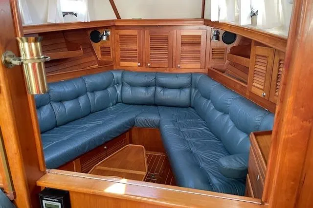 Slide: The Image of Luxurious interior of 2000 Gozzard 37 sailboat with blue leather seating. - 16