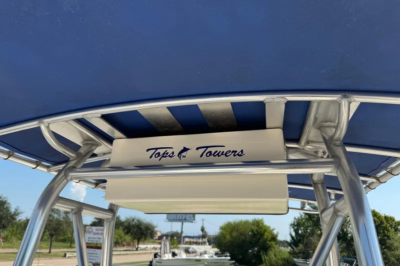 Slide: The Image of T-top of 2002 Sea Fox 236 Center Console with "Tops N Towers" branding. - 14