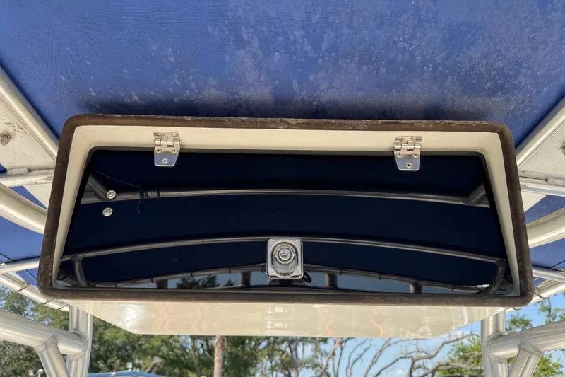 Slide: The Image of Storage compartment on a 2002 Sea Fox 236 Center Console boat with blue interior. - 15