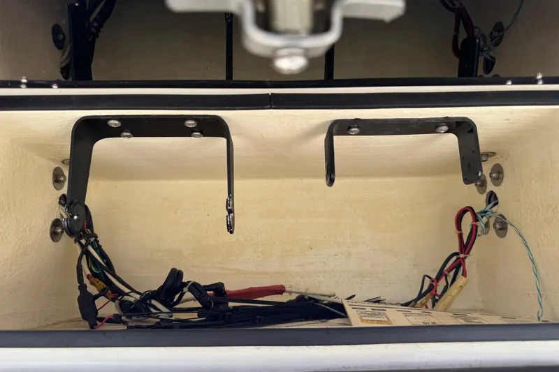 Slide: The Image of 2002 Sea Fox 236 Center Console wiring compartment with brackets and cables. - 16