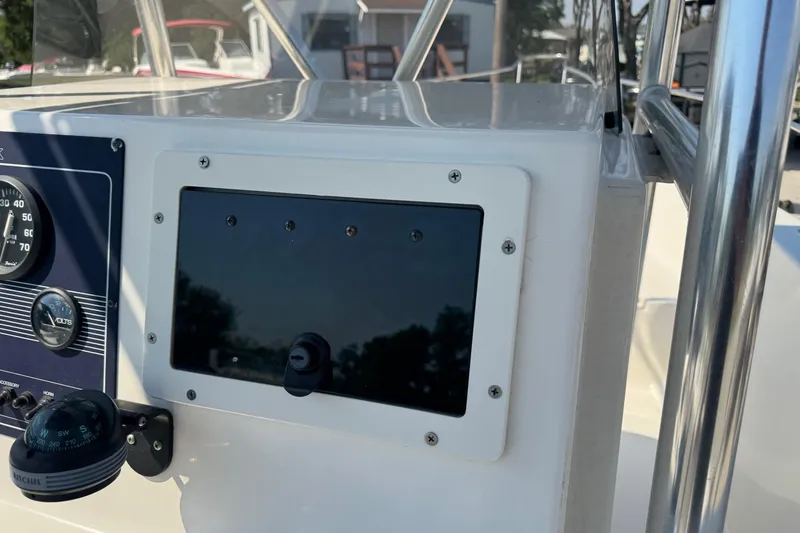 Slide: The Image of Console of 2002 Sea Fox 236 Center Console boat with gauges and compass. - 18