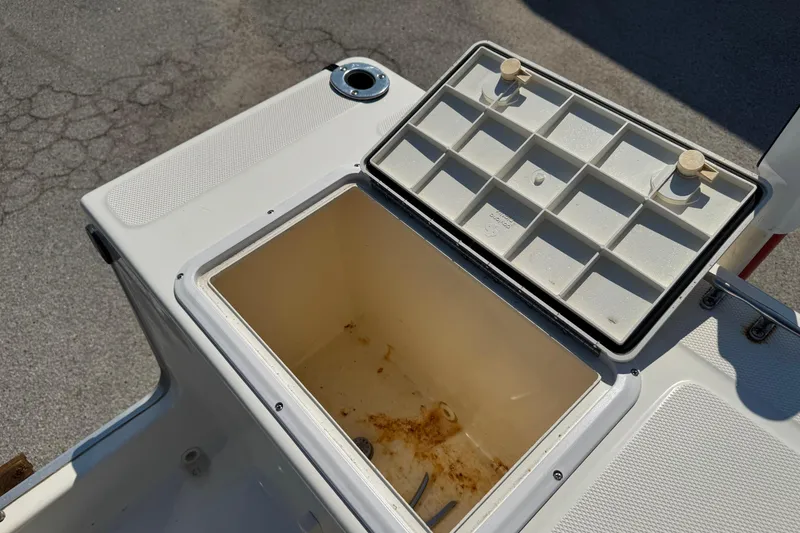 Slide: The Image of Open storage compartment on 2002 Sea Fox 236 Center Console boat. - 25