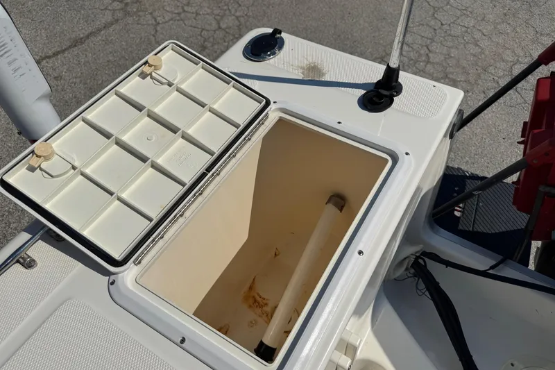 Slide: The Image of Open storage compartment on a 2002 Sea Fox 236 Center Console boat. - 26