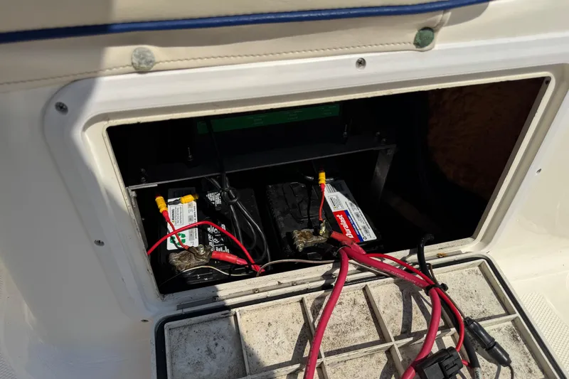 Slide: The Image of Battery compartment of a 2002 Sea Fox 236 Center Console boat with visible wiring. - 28