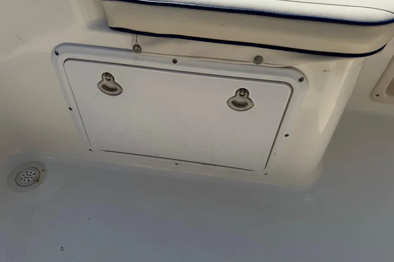 Slide: The Image of Storage compartment on a 2002 Sea Fox 236 Center Console boat interior. - 29