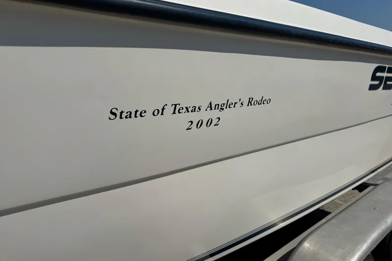 Slide: The Image of 2002 Sea Fox 236 Center Console boat with "State of Texas Angler's Rodeo" text. - 3