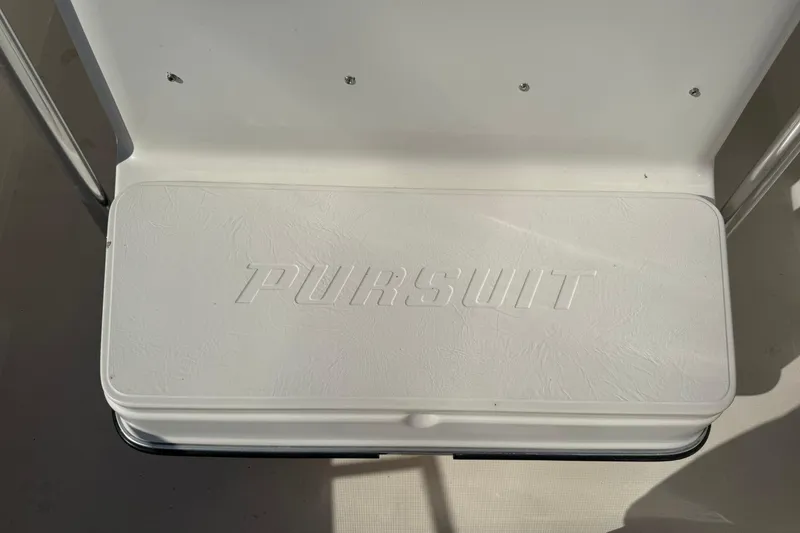 Slide: The Image of White seat with "Pursuit" logo on a 1994 Pursuit 2150 Dual Console boat. - 21