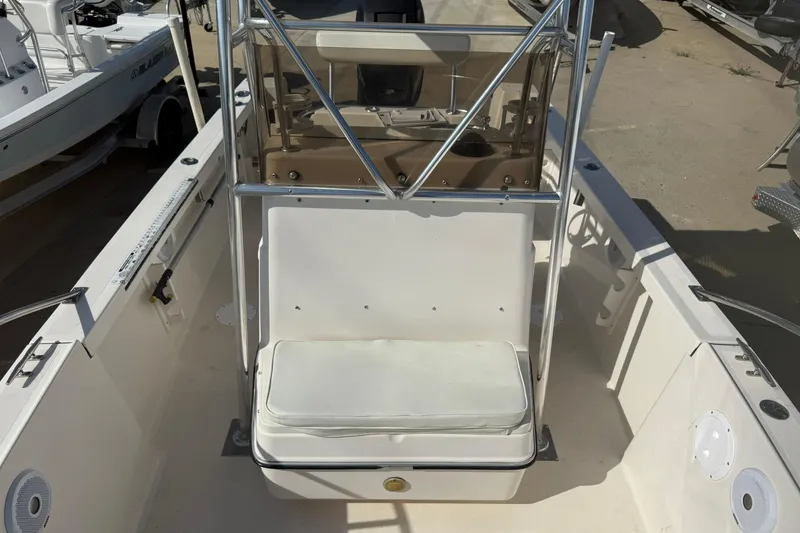 Slide: The Image of 1994 Pursuit 2150 Dual Console boat interior with seating and steering console. - 22
