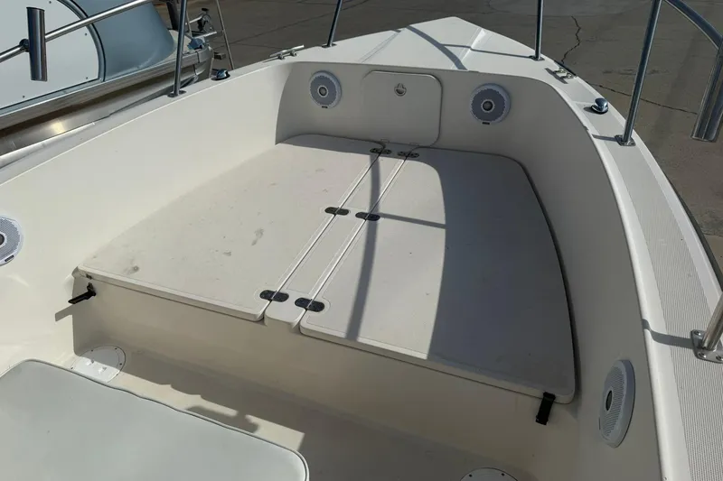 Slide: The Image of 1994 Pursuit 2150 Dual Console boat interior with seating and storage compartments. - 26
