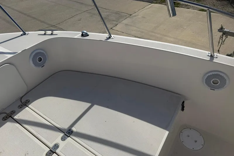 Slide: The Image of 1994 Pursuit 2150 Dual Console boat interior with speakers and storage compartments. - 29