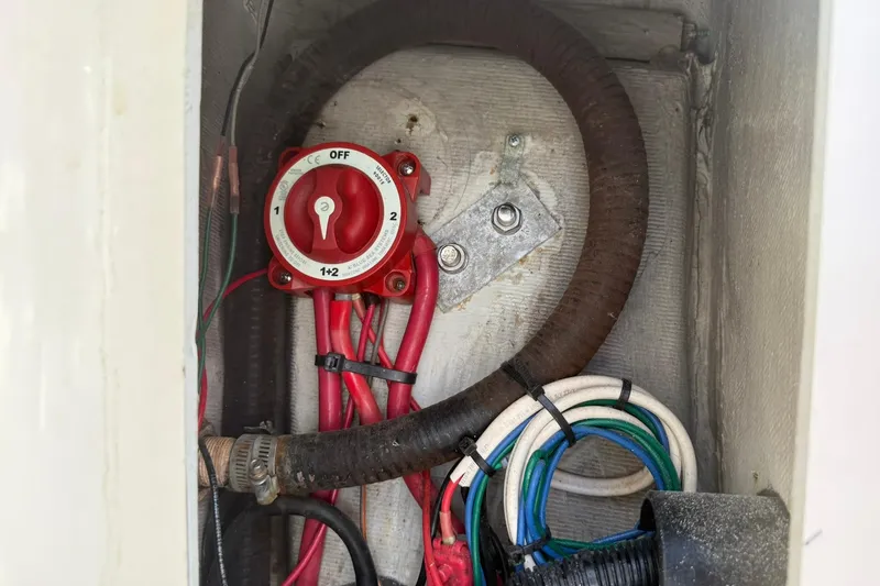 Slide: The Image of Electrical wiring and switch inside a 1994 Pursuit 2150 Dual Console boat. - 34