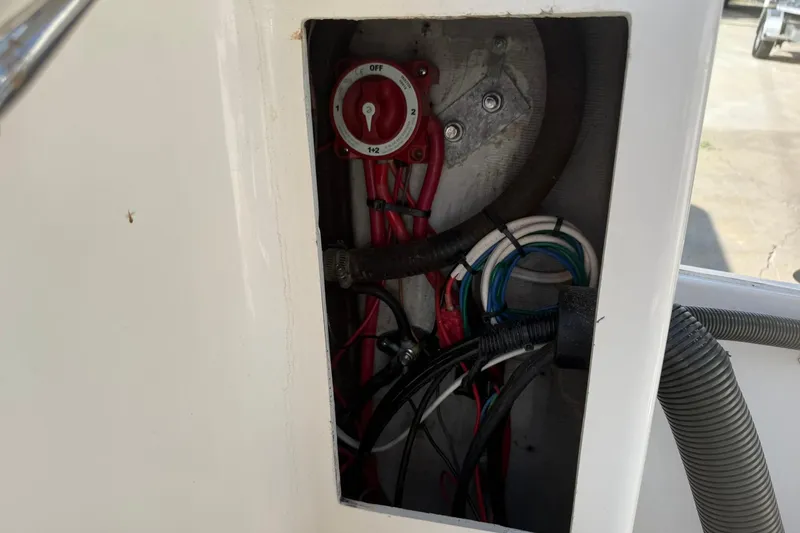 Slide: The Image of Electrical wiring and switch inside a 1994 Pursuit 2150 Dual Console boat. - 35