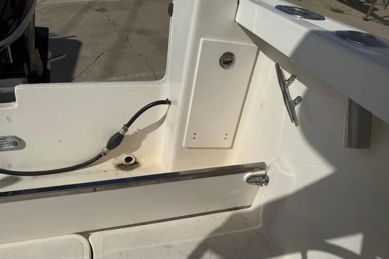 Slide: The Image of 1994 Pursuit 2150 Dual Console boat interior showing deck details and fittings. - 39