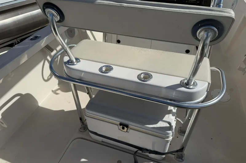 Slide: The Image of 1994 Pursuit 2150 Dual Console boat interior with seating and storage. - 43