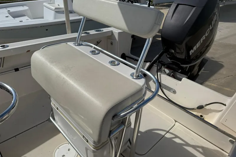 Slide: The Image of 1994 Pursuit 2150 Dual Console boat interior with Mercury outboard motor. - 47